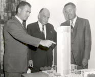 Model of Electronics Research Centers first phase of construction is examined by (from left) Dr. Albert J. Kelley, Deputy Director; Edward Durell Stone, architect, of the joint venture team which designed the facilities; and Dr. Winston E. Kock, Director. 