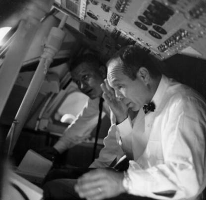 Members of the Apollo 204 Review Board, Astronaut Frank Borman and Max Faget (foreground), inspect the interior of an Apollo Command Module mock-up at the Kennedy Space Center on April 9, 1967, as part of the Board's investigation of the fire that took the lives of the Apollo 1 crew, Chaffee, White, and Grissom at Launch Complex 34 on January 27.